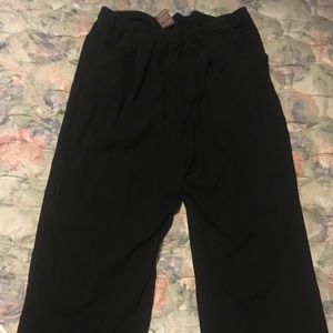 Pair of black sweat pants with pockets
